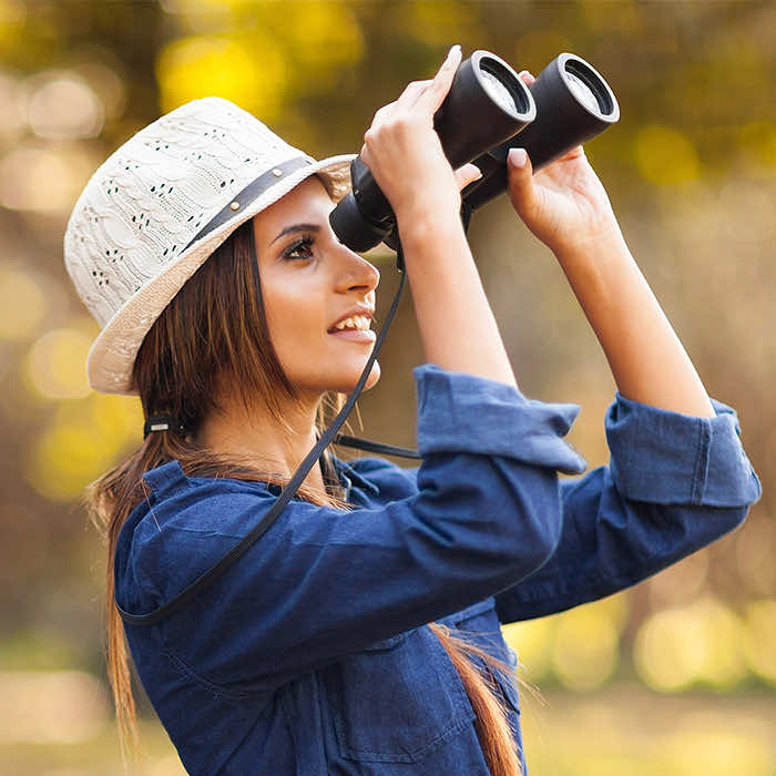 woman using binoculars